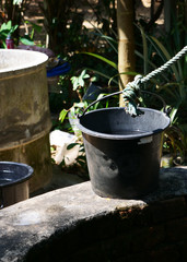 Obraz premium typical well with bucket and robe