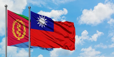 Naklejka na ściany i meble Eritrea and Taiwan flag waving in the wind against white cloudy blue sky together. Diplomacy concept, international relations.