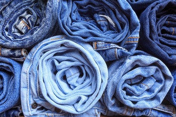 Fototapeta na wymiar background of a stack rolled jeans (vintage) - Image