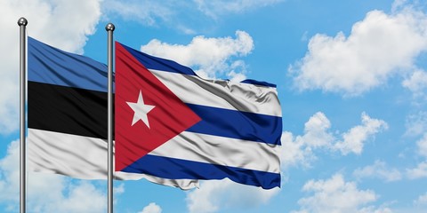 Estonia and Cuba flag waving in the wind against white cloudy blue sky together. Diplomacy concept, international relations.