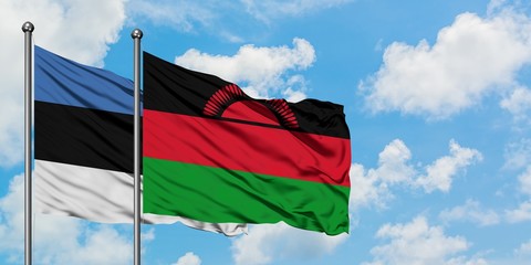 Estonia and Malawi flag waving in the wind against white cloudy blue sky together. Diplomacy concept, international relations.