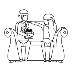 lovers couple with christmas hat and gift seated in sofa