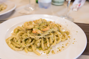 Busiate with pistachio pesto and shrimps served in a restaurant in Sicily, Italy - 300838539