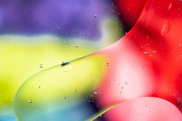 Mixing water and oil drops. Macro Colorful background. Fluid gradient inks modern creative design....