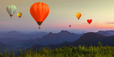 Fototapeta premium Balloon on twilight sky over high mountains viewpoint at sunset