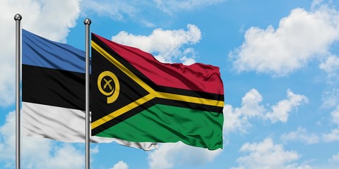 Estonia and Vanuatu flag waving in the wind against white cloudy blue sky together. Diplomacy concept, international relations.