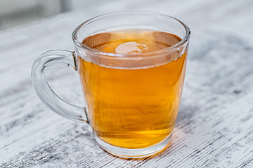 a mug on the table full of lager