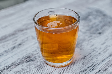 a mug on the table full of lager