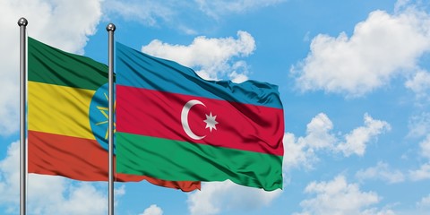 Ethiopia and Azerbaijan flag waving in the wind against white cloudy blue sky together. Diplomacy concept, international relations.