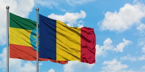 Ethiopia and Chad flag waving in the wind against white cloudy blue sky together. Diplomacy...