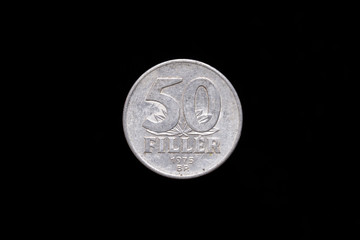 Old Hungarian 50 Filler coin from 1975, reverse. Isolated on black background