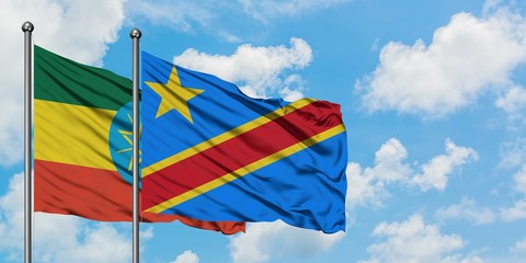 Ethiopia and Congo flag waving in the wind against white cloudy blue sky together. Diplomacy concept, international relations.