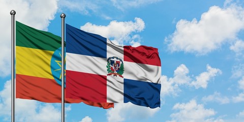 Ethiopia and Dominican Republic flag waving in the wind against white cloudy blue sky together. Diplomacy concept, international relations.