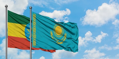 Ethiopia and Kazakhstan flag waving in the wind against white cloudy blue sky together. Diplomacy concept, international relations.