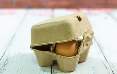 paper egg box with an agg inside