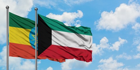 Ethiopia and Kuwait flag waving in the wind against white cloudy blue sky together. Diplomacy concept, international relations.