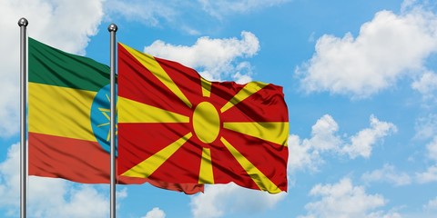 Ethiopia and Macedonia flag waving in the wind against white cloudy blue sky together. Diplomacy concept, international relations.