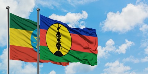 Ethiopia and New Caledonia flag waving in the wind against white cloudy blue sky together. Diplomacy concept, international relations.