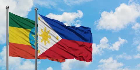 Ethiopia and Philippines flag waving in the wind against white cloudy blue sky together. Diplomacy concept, international relations.
