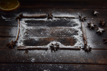 cinnamon stick frame stars star anise icing sugar for Christmas decor