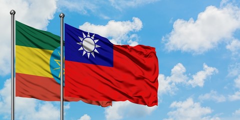 Ethiopia and Taiwan flag waving in the wind against white cloudy blue sky together. Diplomacy concept, international relations.