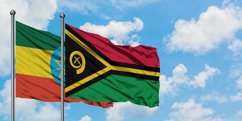 Ethiopia and Vanuatu flag waving in the wind against white cloudy blue sky together. Diplomacy concept, international relations.