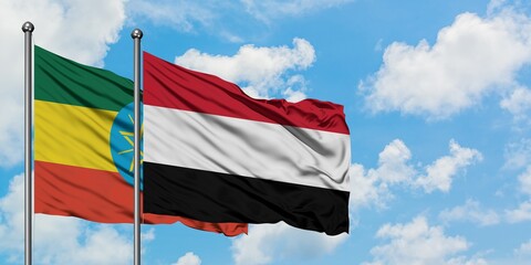 Ethiopia and Yemen flag waving in the wind against white cloudy blue sky together. Diplomacy concept, international relations.