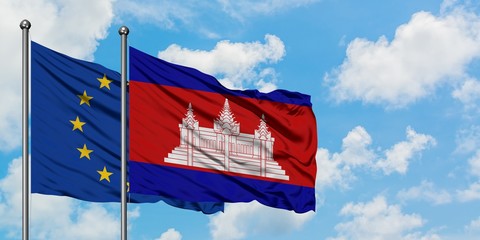 European Union and Cambodia flag waving in the wind against white cloudy blue sky together. Diplomacy concept, international relations.
