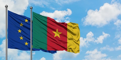 European Union and Cameroon flag waving in the wind against white cloudy blue sky together. Diplomacy concept, international relations.