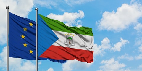 European Union and Equatorial Guinea flag waving in the wind against white cloudy blue sky together. Diplomacy concept, international relations.