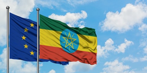 European Union and Ethiopia flag waving in the wind against white cloudy blue sky together. Diplomacy concept, international relations.