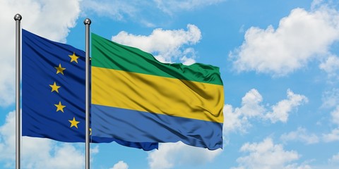 European Union and Gabon flag waving in the wind against white cloudy blue sky together. Diplomacy concept, international relations.