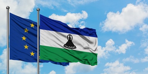 European Union and Lesotho flag waving in the wind against white cloudy blue sky together. Diplomacy concept, international relations.