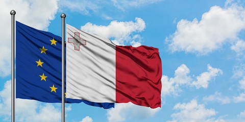 European Union and Malta flag waving in the wind against white cloudy blue sky together. Diplomacy concept, international relations.