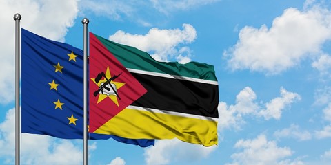 European Union and Mozambique flag waving in the wind against white cloudy blue sky together. Diplomacy concept, international relations.