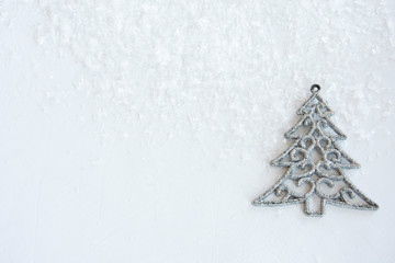 Christmas card silver Christmas tree on a bright shimmering pastel background.