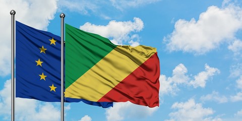European Union and Republic Of The Congo flag waving in the wind against white cloudy blue sky together. Diplomacy concept, international relations.