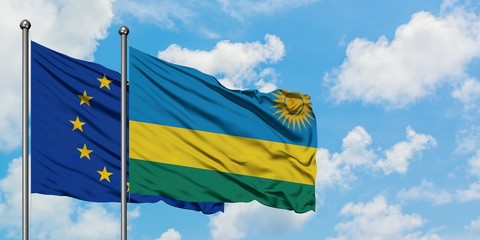 European Union and Rwanda flag waving in the wind against white cloudy blue sky together. Diplomacy concept, international relations.