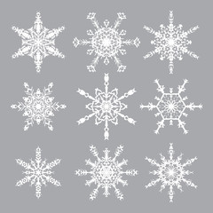 Fototapeta na wymiar Snowflakes Vector Set. Snowflakes icons. White snowflakes on gray background