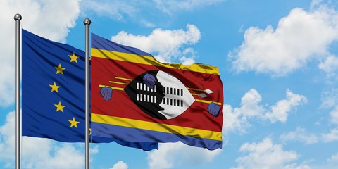 European Union and Swaziland flag waving in the wind against white cloudy blue sky together. Diplomacy concept, international relations.