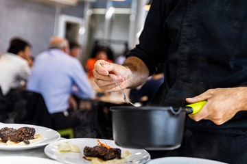 Chef preparing food for his clients
