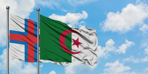 Faroe Islands and Algeria flag waving in the wind against white cloudy blue sky together. Diplomacy concept, international relations.