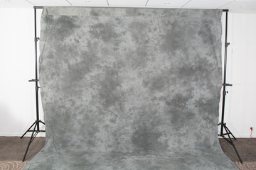 Abstract patterned gray studio background in old fabric backdrop
