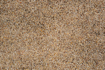 Multicolour small pebble or gravel wall, textured and background.