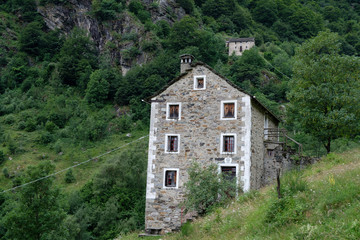 Fototapeta na wymiar vacant residential building in the Italian Alps