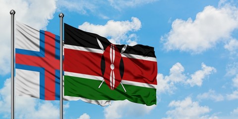 Faroe Islands and Kenya flag waving in the wind against white cloudy blue sky together. Diplomacy concept, international relations.