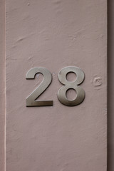 metal number 28 on wall