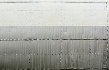 Aluminum sheet and rivet fastening. Aviation background.