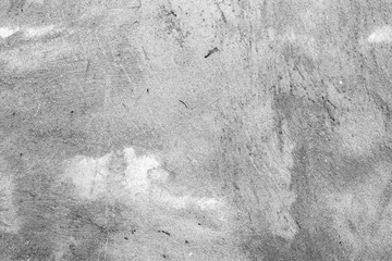 Fototapeta premium Texture of a concrete wall with cracks and scratches which can be used as a background
