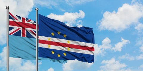 Fiji and Cape Verde flag waving in the wind against white cloudy blue sky together. Diplomacy concept, international relations.